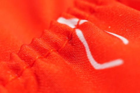 Custom mini football kit stitching detail